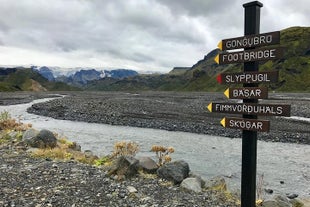 A wooden signpost points the way along the Fimmvorduhals trail.