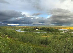 The tranquil Oxara River flows through the scenic Thingvellir National Park in Iceland.