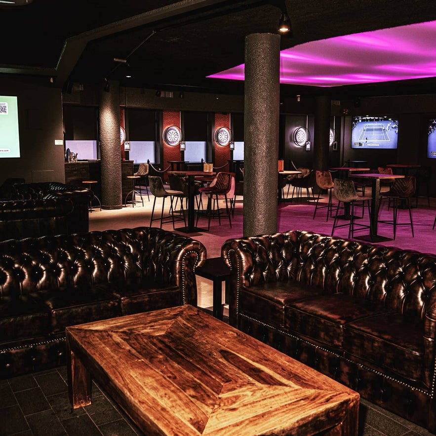 Comfortable seating and dart setups at Bullseye, a casual entertainment spot in Reykjavik. Comfortable seating and dart setups at Bullseye, a casual entertainment spot in Reykjavik.