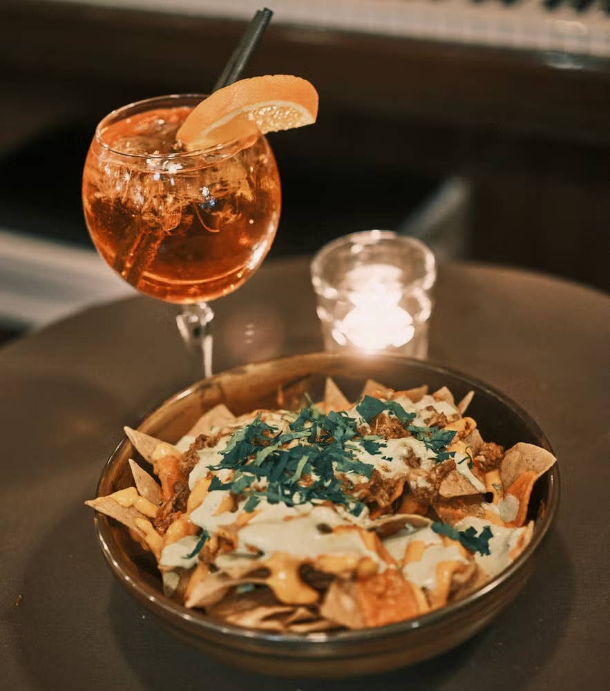 Elly Bar in Reykjavik featuring tasty nachos and a cocktail.