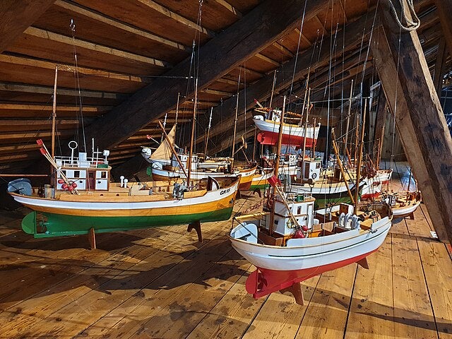 Traditional Icelandic fishing boat samples on display at the Keflavik Maritime Center, part of Duus Museum’s waterfront exhibitions.