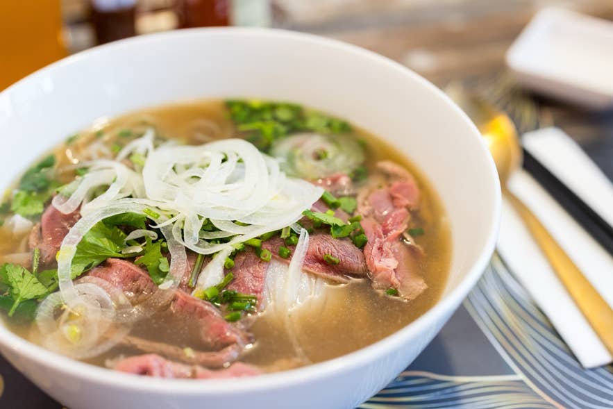 A large bowl of Vietnamese pho, beef noodles