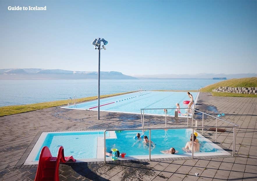 Hofsos Swimming Pool in North Iceland is one of the hidden gems in Iceland with infinity-edge views over Skagafjordur Fjord.