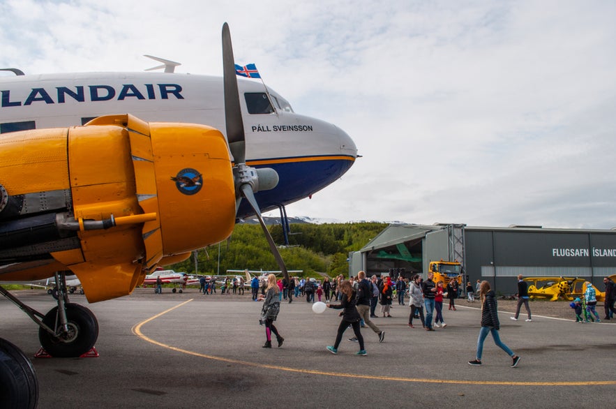 Visitors walk past a vintage Icelandair plane outside the Icelandic Aviation Museum in Akureyri.