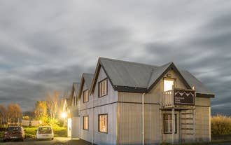 Step into a world of rustic charm at Skyrhusid HI Hostel.