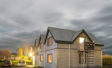 Step into a world of rustic charm at Skyrhusid HI Hostel.