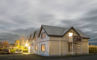 Step into a world of rustic charm at Skyrhusid HI Hostel.