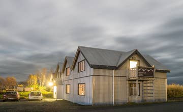 Step into a world of rustic charm at Skyrhusid HI Hostel.