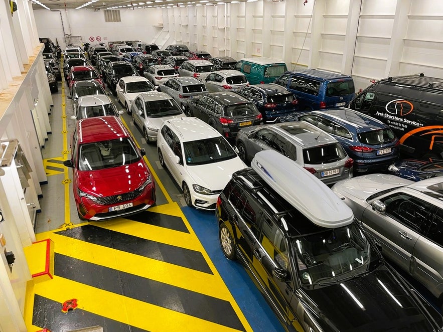 Cars and campervans parked on the vehicle deck of the Smyril Line Norrona ferry to Iceland from Denmark via the Faroe Islands.