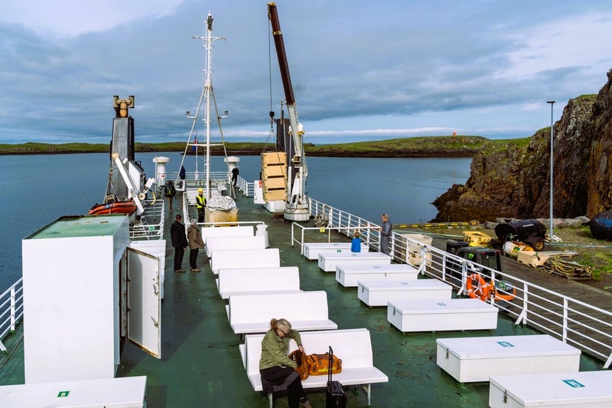 Passengers on the Baldur ferry to Iceland’s Westfjords departing Stykkisholmur with a stop at Flatey Island in Breidafjordur Bay.