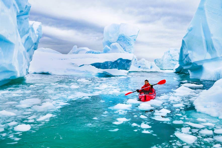 Kayaking through Jokulsarlon Glacier Lagoon, one of the top activities in Iceland for adrenaline junkies.