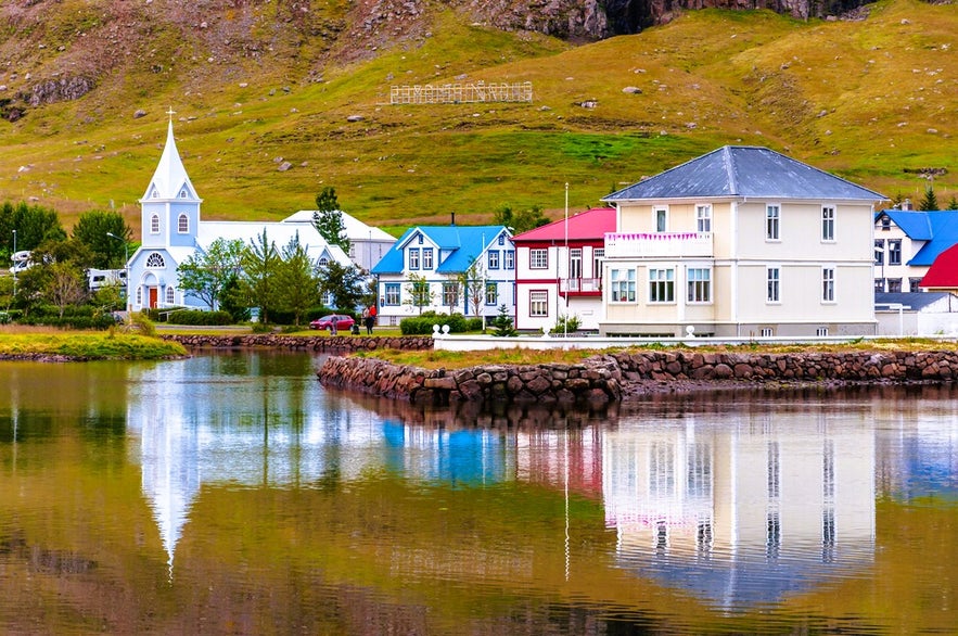 One of the top things to do in Seydisfjordur is visit the Blue Church and colorful houses by the fjord in East Iceland. One of the top things to do in Seydisfjordur is visit the Blue Church and colorful houses by the fjord in East Iceland.