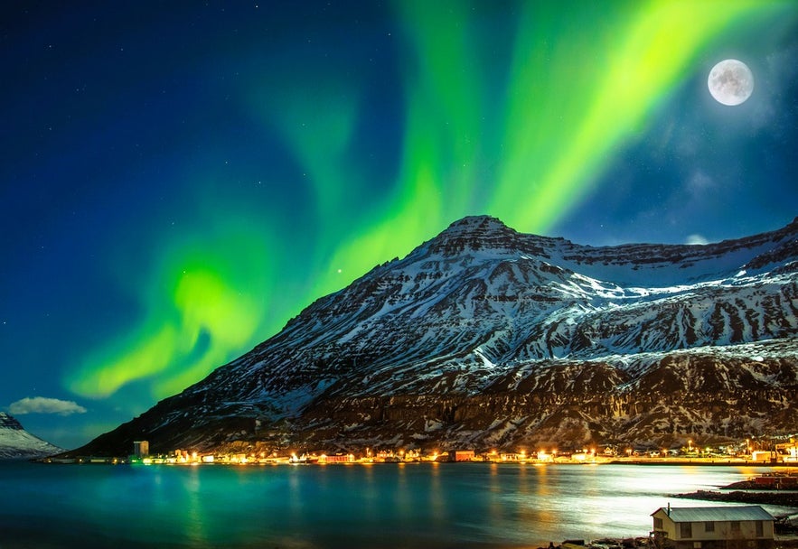 Watching the northern lights over Seydisfjordur Fjord in winter is one of the top things to do in Seydisfjordur, East Iceland.