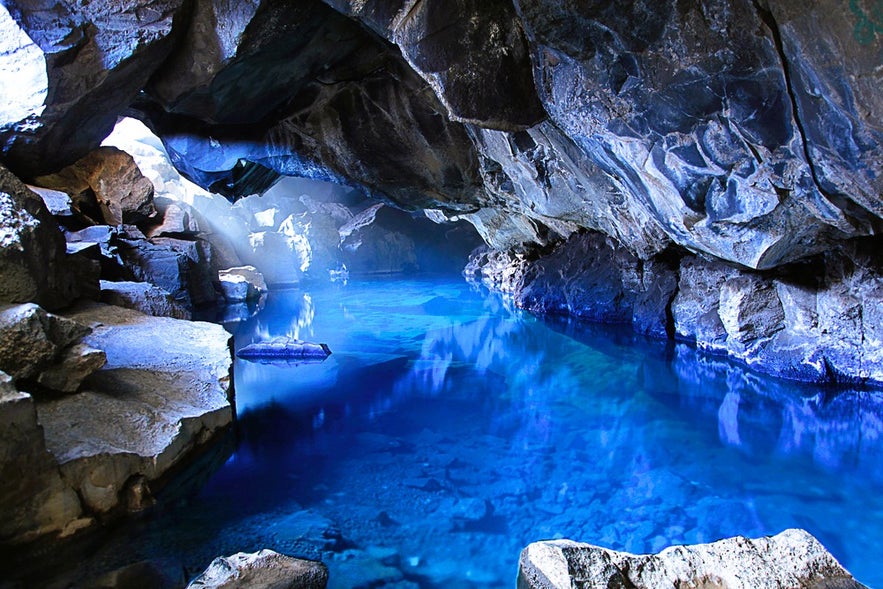 Grjotagja Hot Spring Cave near Dimmuborgir in Iceland, a famous Game of Thrones filming location with crystal blue water.