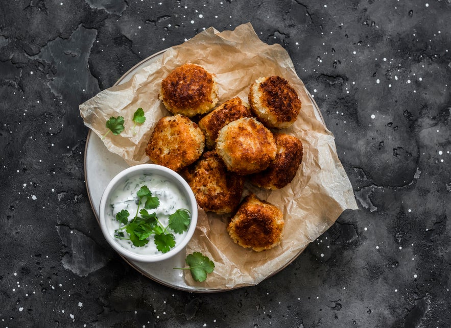 Plate of fiskibollur, traditional Icelandic fish balls served with sauce.