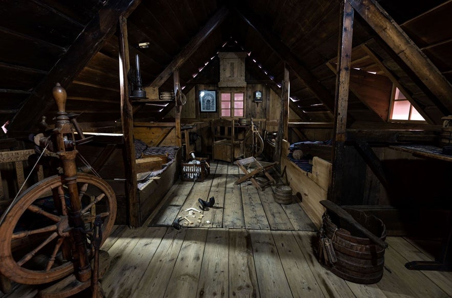 A bed and work room from an 20th century turf house preserved and on display at the National Museum of Iceland