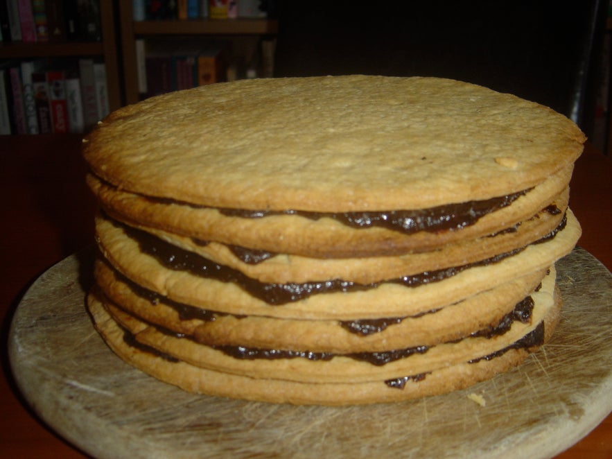 Vínarterta, traditional Icelandic layered cake with prune filling and powdered sugar on top.