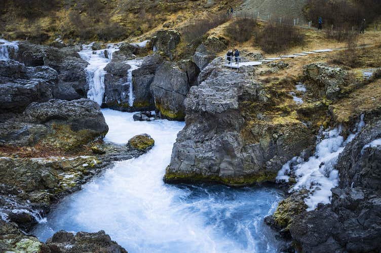 Barnafoss Waterfall rushing through volcanic rock formations in the Silver Circle, Iceland.