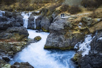 Barnafoss Waterfall rushing through volcanic rock formations in the Silver Circle, Iceland.