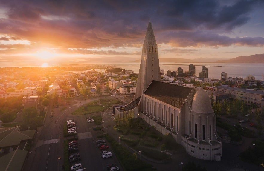 Hallgrimskirkja with Reykjavik in the background during sunset