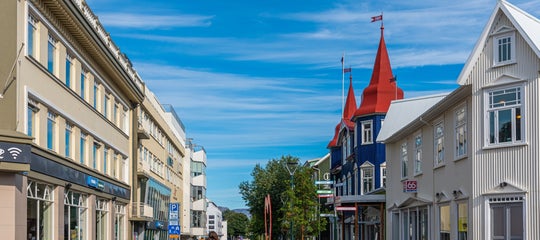 Akureyri street houses 66 north stores person shutterstock.jpg
